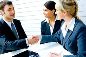 Businessman and businesswoman doing handshake