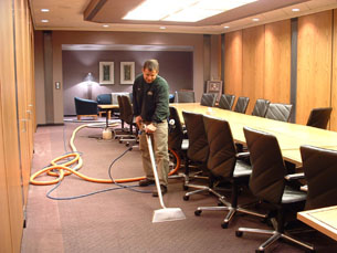 A Man cleaning a carpet