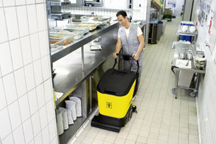 A Man cleaning a floor