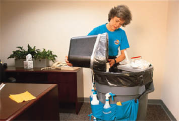 A lady cleaning an office