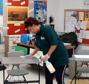 A Woman cleaning a table
